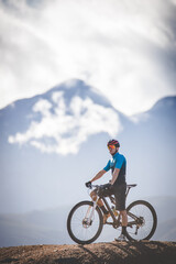 Naklejka premium Close up image of a mountain biker speeding downhill on a mountain bike track