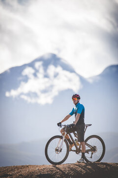 Close up image of a mountain biker speeding downhill on a mountain bike track