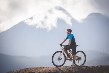 Fototapeta premium Close up image of a mountain biker speeding downhill on a mountain bike track