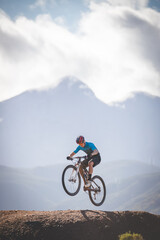 Fototapeta na wymiar Close up image of a mountain biker speeding downhill on a mountain bike track