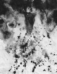 Black ink stains, dots, spatter and splashes on white paper background