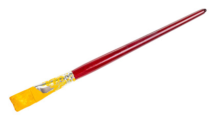 flat paint brush with yellow colored tip and brown handle isolated on white background