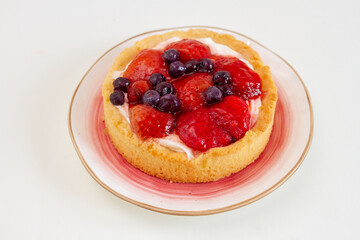 Strawberry tart cake on white background. Selective focus