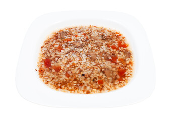 meat soup with buckwheat in white soup plate isolated on white background