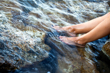 Young Woman Foot in the Clean Sea Water