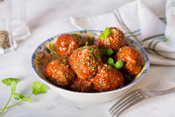 Meatballs in bowl on white background