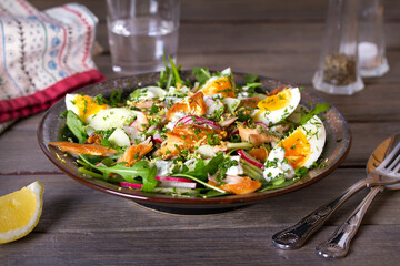 Smocked mackerel salad with eggs and radish. Healthy diet food