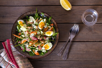Smocked mackerel salad with eggs and radish. Healthy diet food. View from above, top studio shot