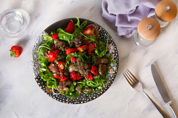 Chicken liver salad with strawberries. View from above, top view