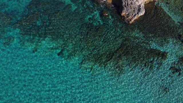 Tropical seashore with rocks from drone