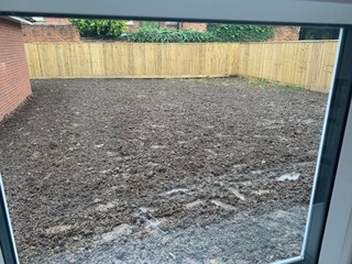 mud-filled back garden, waiting for fresh turfing.   a new start. 