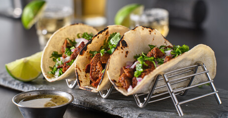 metal taco holder with three mexican carne asada street-tacos