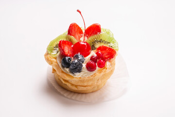Home made cake with cream and fruits isolated.