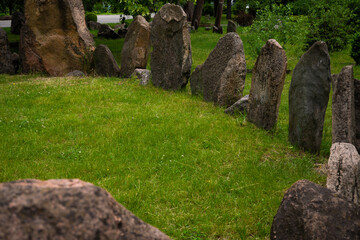 Megalithic stone circle Kriviy Rih city, Ukraine, city park. Summer time. Juicy grass among the ancient pagan sanctuary