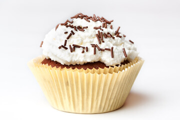 chocolate cupcake with whipped cream vanilla cream with decorative sprinkles