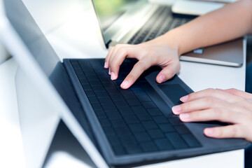 Blurred soft images, the Hand of business people Which is placed on the keyboard of the notebook is printing data The details of the plan for success at workplace