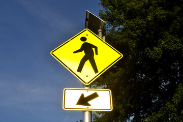 A Yellow Pedestrian Crosswalk Signage