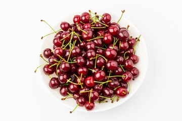 fresh red cherry fruit in plate  isolated on white background