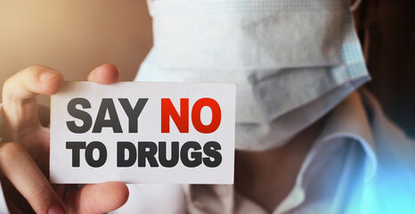 Doctor holding a card with Say no to drugs, Medical drugs addiction prevention awareness healthcare...