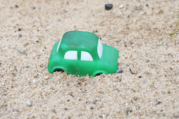 old toy cars in the sandbox