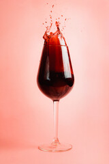 Red wine splash in a glass, dynamic picture, selective focus.