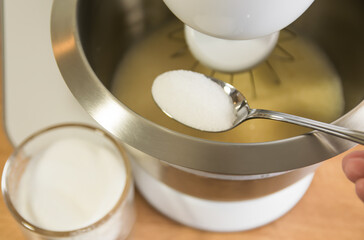 Metal dough with biscuit and electric mixer.