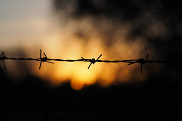 Sunset Behind The Barbed Wire..