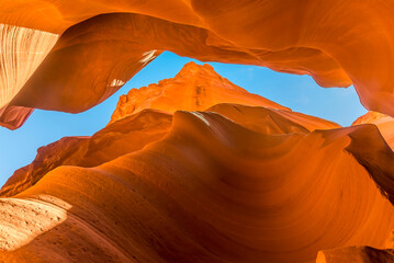 Blue sky viewed through a crack in the canyon in lower Antelope Canyon, Page, Arizona