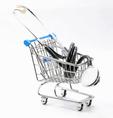 stethoscope on a shopping cart symbol of health care spending