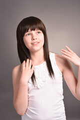 Cute happy girl with dark hair posing