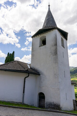 Fototapeta na wymiar view of the historic town church in the Swiss Alps village of Zillis-Reischen