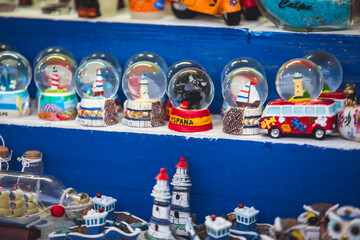 View of traditional tourist souvenirs and gifts from Calpe, Calp, Alicante, Valencia with toys,...