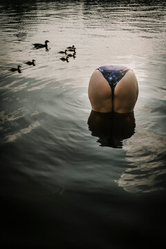 Europe, Germany, Berlin, Woman bathing in a lake.