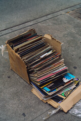 stacked vinyl record albums LP on street trash sidewalk