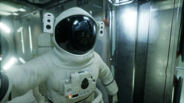 astronaut inside the orbital space station. Elements of this image furnished by NASA.