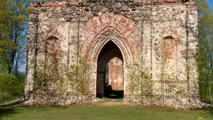 Fototapeta na wymiar The Ruins of Veckalsnava Church. Olds Architecture Details of the Lutheran Church in the Kalsnava Parish Latvia. Sunny Spring Day.