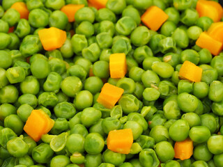 Cooked fresh green peas close-up