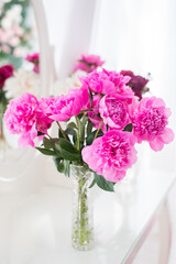 Bouquet of pink peonies on a white background.