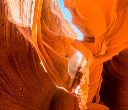 Shafts of sunlight paint bright patches on the walls of lower Antelope Canyon, Page, Arizona