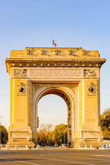 Fototapeta na wymiar Arcul de Triumf, a triumphal arch, the northern part of Bucharest, on the Kiseleff Road