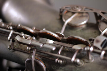 Obraz na płótnie Canvas Detail of worn silver antique saxophone keys