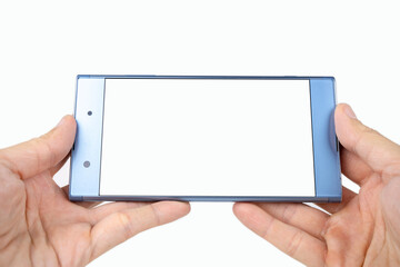 Person holding smartphone in a hand, phone in a woman's hand