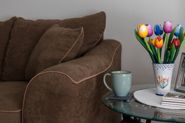 Interior Design of Living Room with Couch, End Table and Vase with Flower Decoration