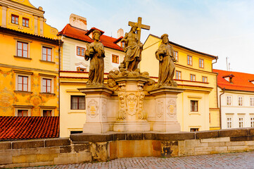 Fototapeta premium Tower of the Charles Bridge, a famous historic bridge that crosses the Vltava river in Prague, Czech Republic.