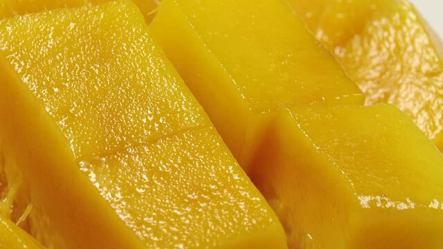 4K Sweet thai mango rotation of rip mango slice cubes cut
