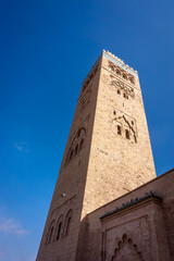 Fototapeta premium Kutubiyya Mosque or Koutoubia Mosque built in 1147 is the largest mosque with the tallest minaret at 77 m high in Marrakesh, Morocco.