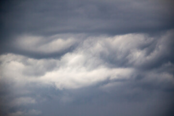 A beautiful stormy sky with clouds. The Dark heavy thunderstorm clouds before the rain. Dramatic cloudscape.
