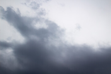 A beautiful stormy sky with clouds. The Dark heavy thunderstorm clouds before the rain. Dramatic cloudscape.
