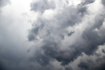A beautiful stormy sky with clouds. The Dark heavy thunderstorm clouds before the rain. Dramatic cloudscape.