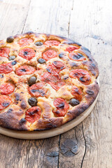 Focaccia typical of Bari Italy with tomatoes and olive